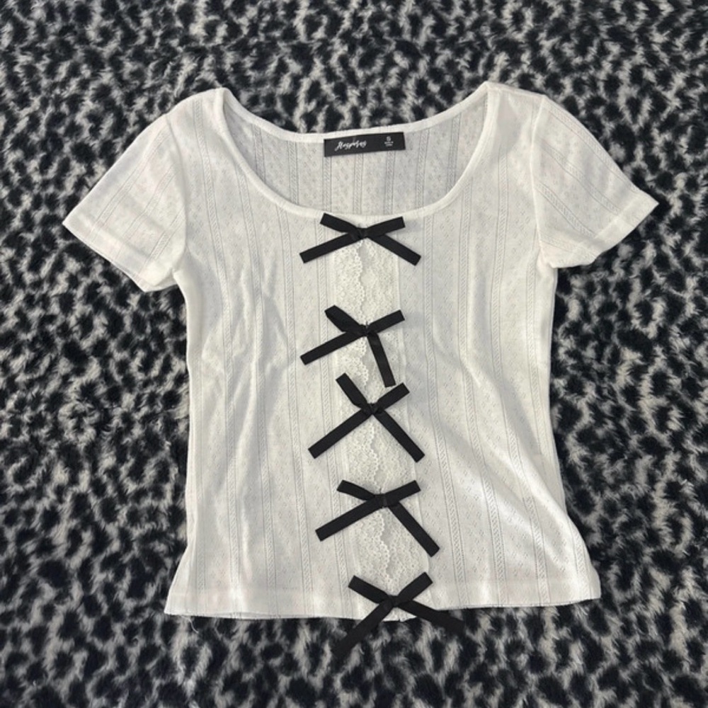 Chic White Top with Black Bow Details